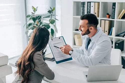 depositphotos_210633308-stock-photo-general-practitioner-pointing-insurance-claim